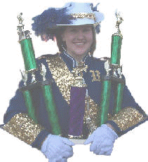 Senior Drum Major Stephanie Lipe holding trophies for 1st Place Overall, 1st Place Class 4A and 1st Place Colorguard, Stockton Walnut Festival.